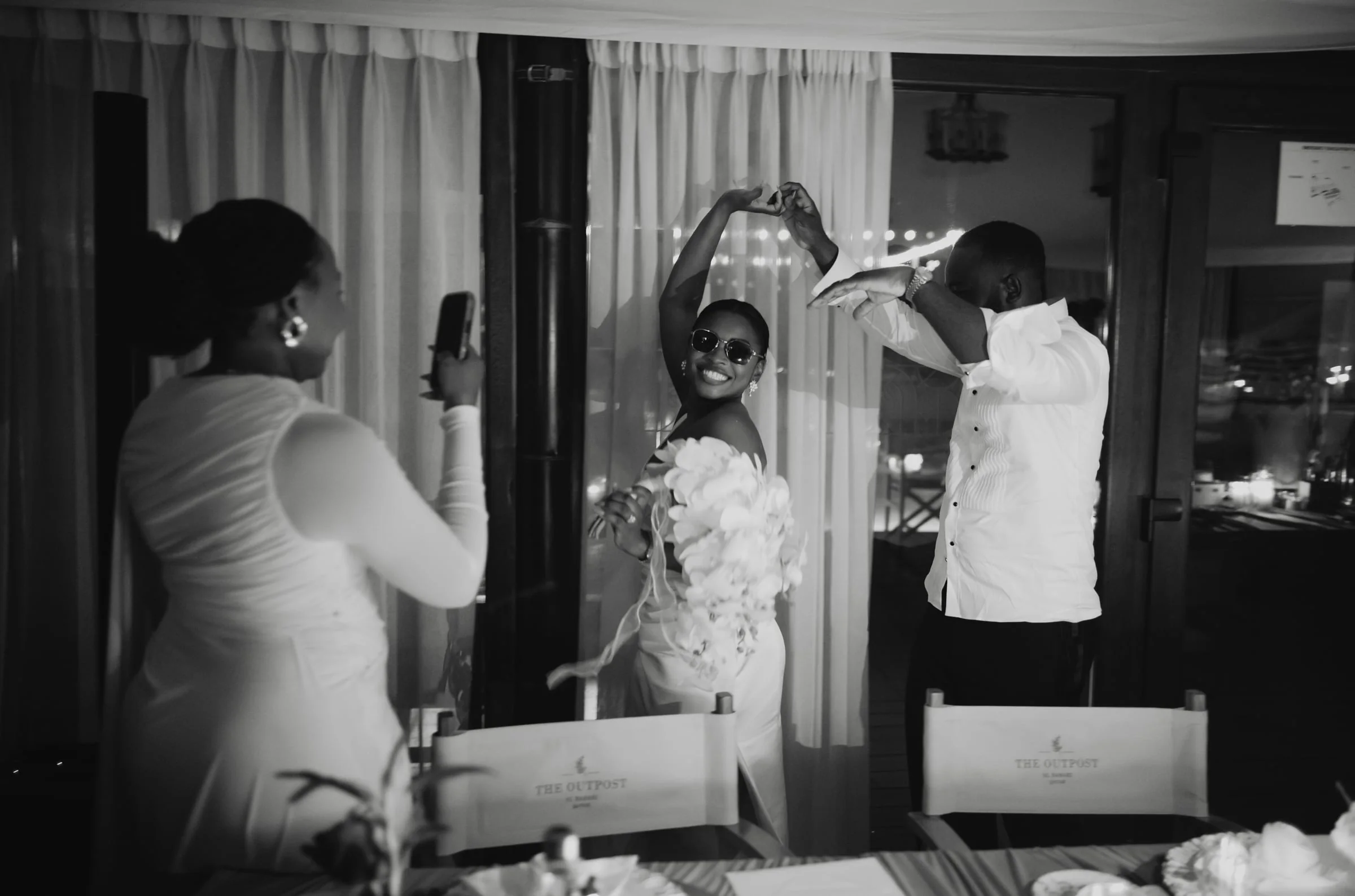 Bride and groom dancing together at their reception in the evening